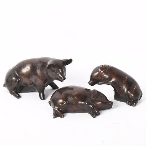 147 - A graduated set of cast-bronze pigs, tallest 8cm