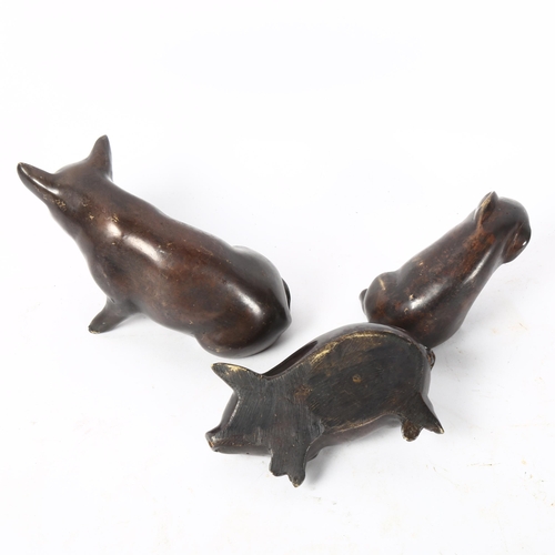 147 - A graduated set of cast-bronze pigs, tallest 8cm