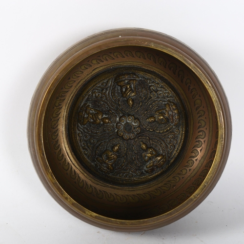 156 - A Tibetan brass singing bowl, with 5 Dhyani embossed internal decoration and engraved body, width 13... 