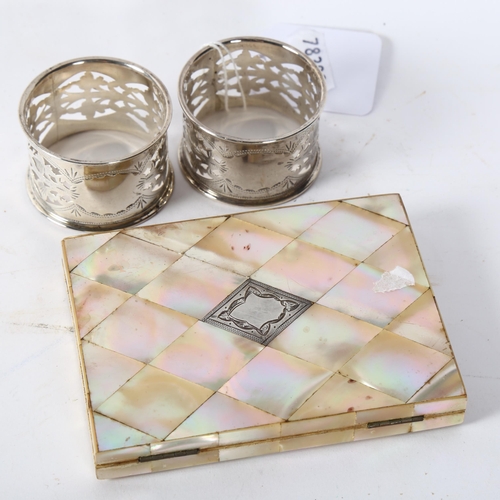 174 - A Victorian mother-of-pearl card case, length 10.5cm, and a pair of pierced silver napkin rings