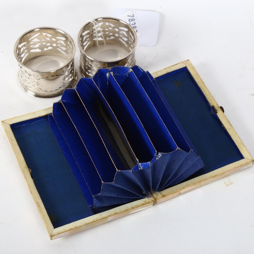 174 - A Victorian mother-of-pearl card case, length 10.5cm, and a pair of pierced silver napkin rings