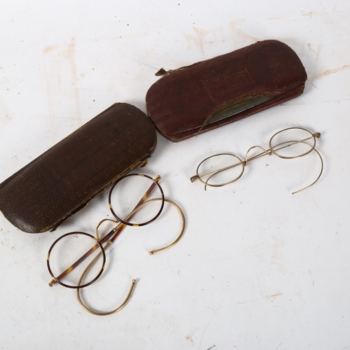 184 - A pair of early 20th century tortoiseshell and 10ct gold glasses, and another, both cased (2)