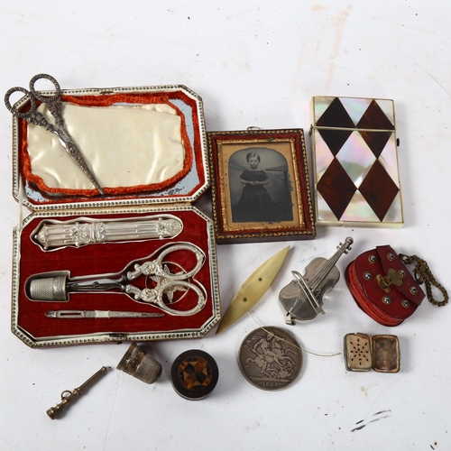 185 - A Victorian mother-of-pearl and tortoiseshell card case, a Victorian silver crown, a small Tunbridge... 