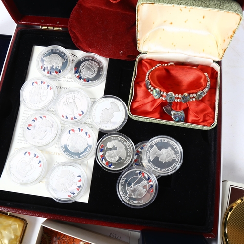 189 - A collection of 50p Jubilee encapsulated coins, a silver and enamel charm bracelet, costume jeweller... 