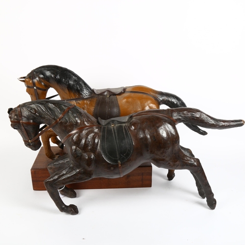 19 - 2 leather-covered prancing horse models, length 64cm, and a hardwood stand