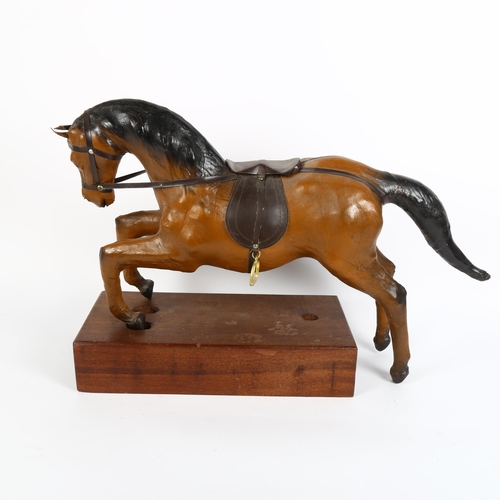 19 - 2 leather-covered prancing horse models, length 64cm, and a hardwood stand