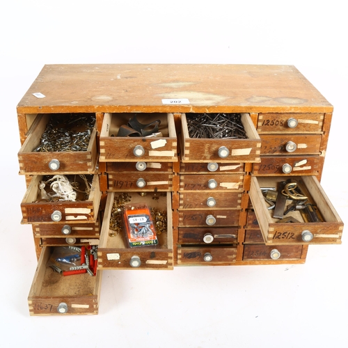 202 - A Vintage 32-drawer collector's/tool chest, with various contents including hardware, 2 drawers miss... 