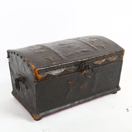 211 - A Black Forest leather-covered dome-top box, with embossed decoration and armorial crest, W34cm