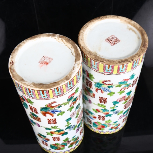 217 - A pair of Chinese famille verte fruit cylinder vases, marks on bases, height 28cm