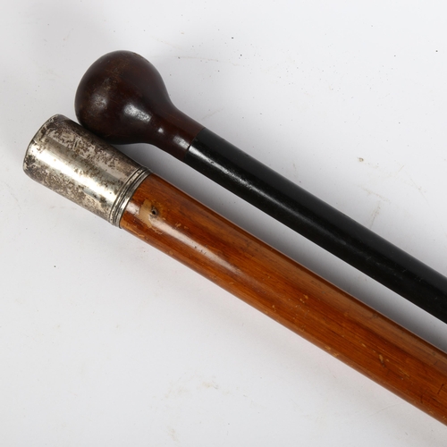 22 - A Malacca walking cane with white metal top, and another ebonised cane, largest length 113cm (2)