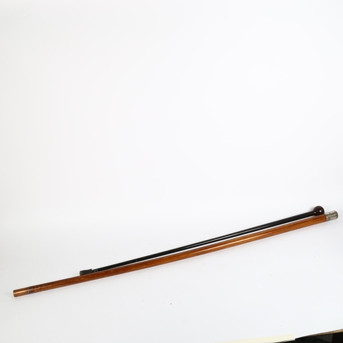 22 - A Malacca walking cane with white metal top, and another ebonised cane, largest length 113cm (2)