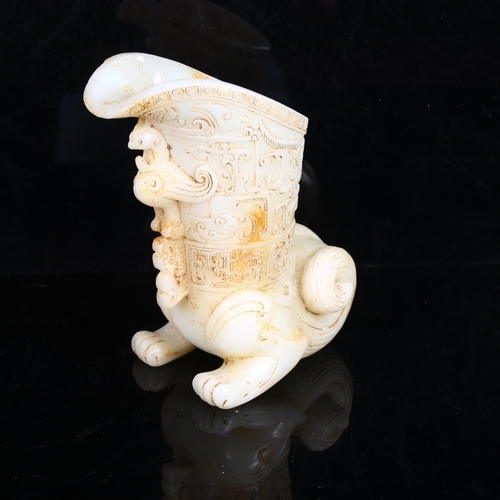 220 - A Chinese white jade libation cup, with phoenix decoration, height 18cm