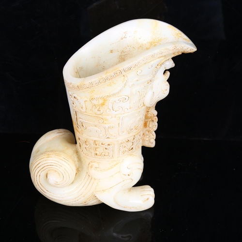 220 - A Chinese white jade libation cup, with phoenix decoration, height 18cm