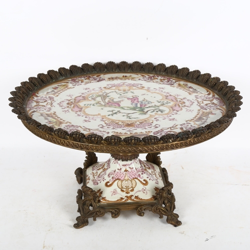 236 - A large reproduction Chinese famille rose and ormolu-mounted table centre, width 42cm, height 24cm