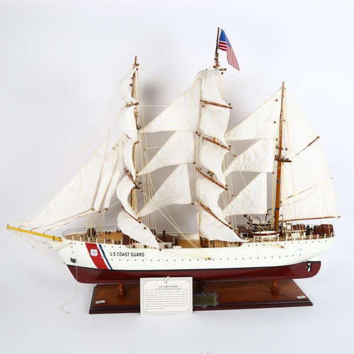 31 - A model US Coastguard Academy Eagle rigged ship on stand, length 85cm