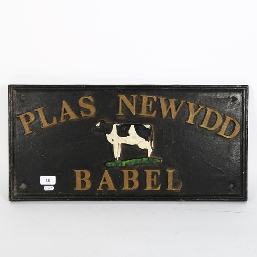 35 - A cast-iron Plaz Newydd Babel dairy advertising sign, 29cm x 60cm