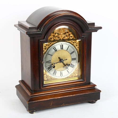 36 - A mahogany dome-top 8-day mantel clock, brass dial with silvered chapter ring, and movement striking... 