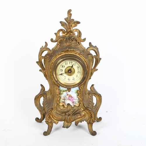 38 - An Art Nouveau gilded spelter foliate mantel clock, with printed porcelain panel, height 28cm, worki... 