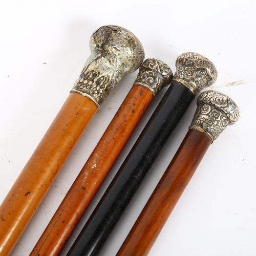 39 - 4 walking canes with silver and white metal knops