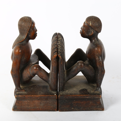 53 - A pair of African Tribal carved hardwood figural bookends, height 25cm
