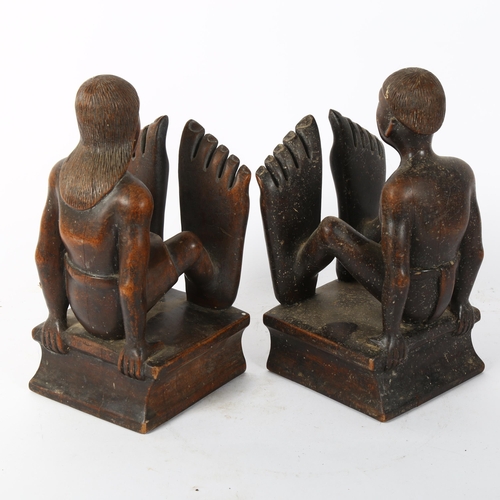 53 - A pair of African Tribal carved hardwood figural bookends, height 25cm