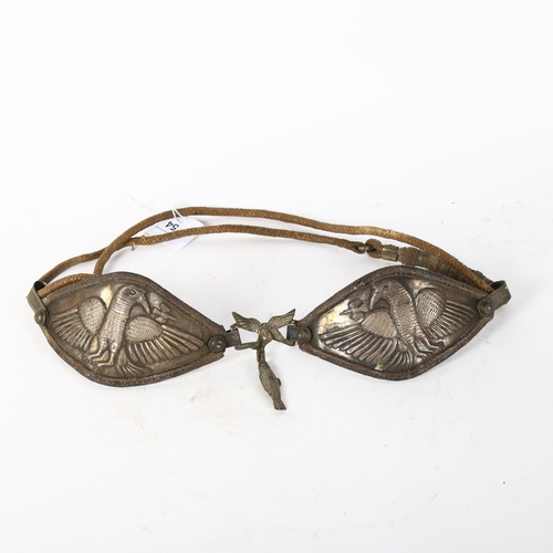 54 - An Indian unmarked white metal bird breastplate, with woven cord, panel length 14cm