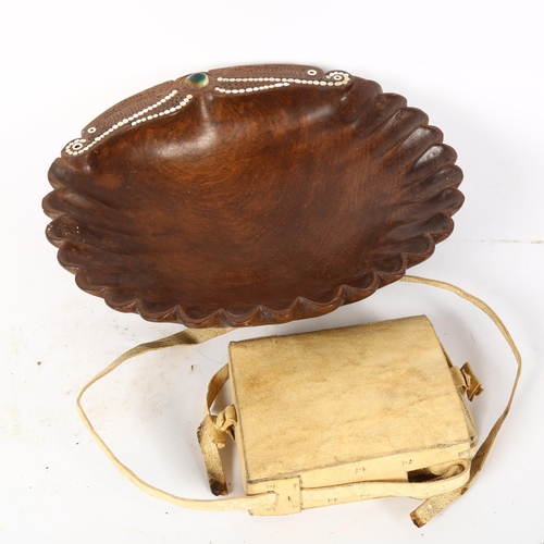 61 - A Papua New Guinea operculum and hardwood bowl, and a Ethiopian vellum satchel, bowl diameter 30cm (... 