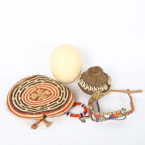 66 - Various African Tribal items, including basketweave cowrie shell lid, beadwork collar necklace, ostr... 