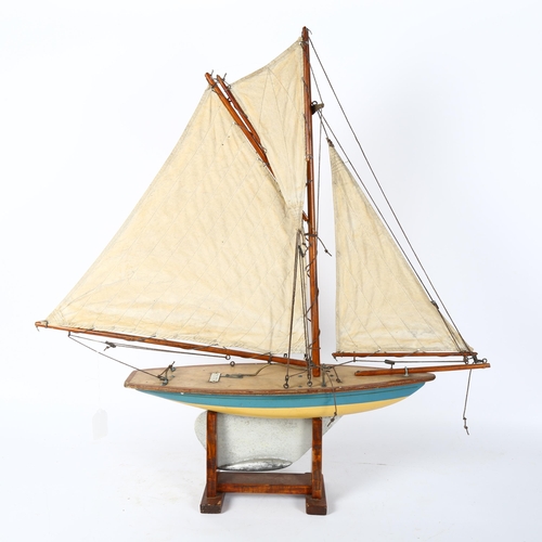 69 - A Vintage wooden-hulled model pond yacht, by Ailsa Yachts of Scotland, hull length 47cm, overall hei... 