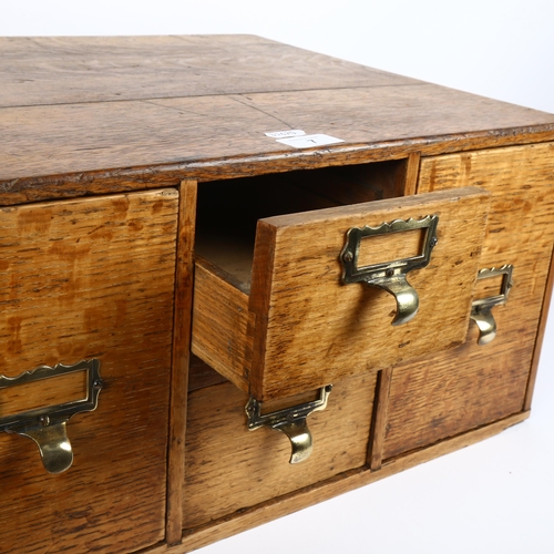 7 - An early 20th century light oak index filing cabinet, W49cm, H24cm, D40cm