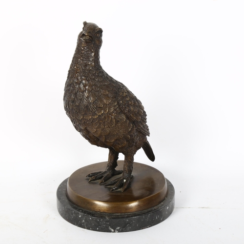 71 - A reproduction patinated bronze sculpture, partridge, unsigned, on black marble base, height 26cm