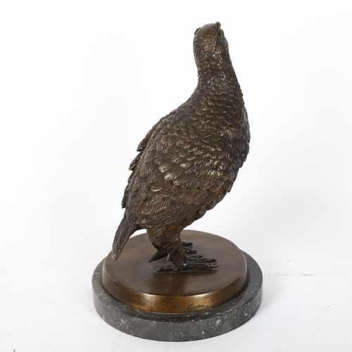 71 - A reproduction patinated bronze sculpture, partridge, unsigned, on black marble base, height 26cm