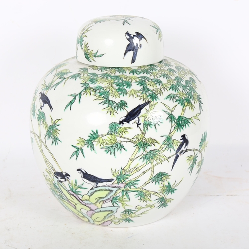 244 - A large Chinese ceramic ginger jar, decorated with bamboo tree and birds, height 26cm