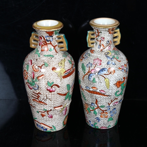 251 - A pair of 19th century chinoiserie transfer printed vases with gilded neck handles, no factory marks... 