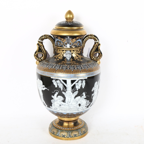 252 - An ornate painted and gilded porcelain vase and cover, height 38cm