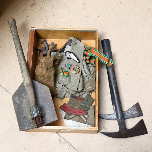 265 - 2 Vintage fireman's axes, a folding Army shovel, military ribbon, badges etc (boxful)