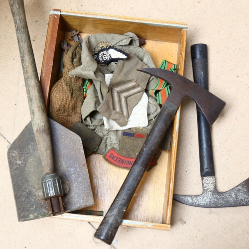 265 - 2 Vintage fireman's axes, a folding Army shovel, military ribbon, badges etc (boxful)