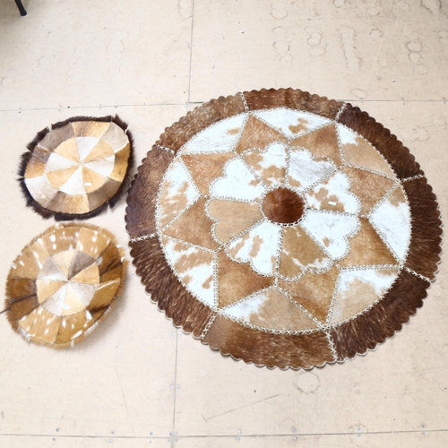 269 - A circular stitched hide mat, and 2 others (3)