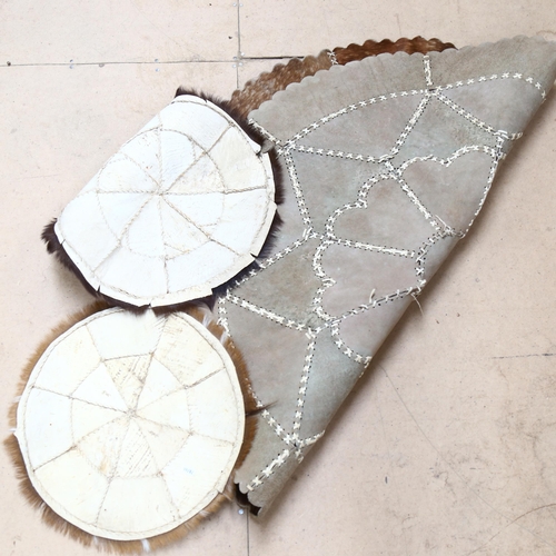 269 - A circular stitched hide mat, and 2 others (3)