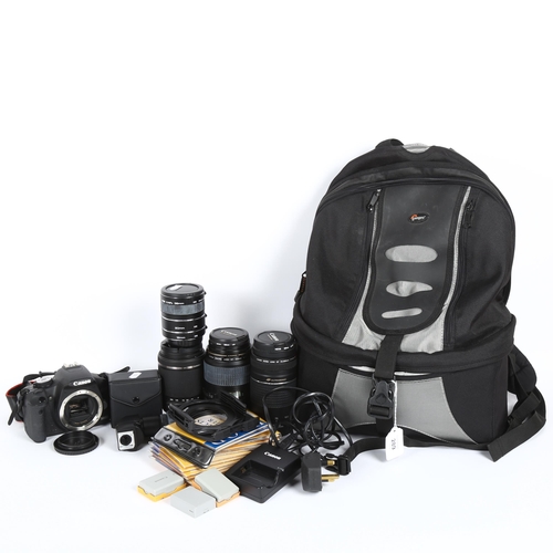 289 - A Canon EOS 500D camera and various lenses, including a Canon ultrasonic zoom lens EF75-300mm, carry... 