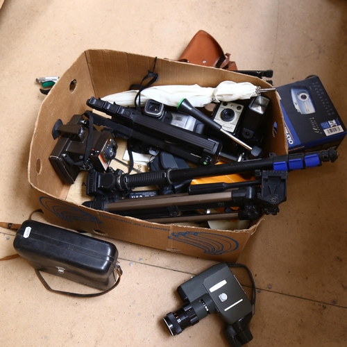 311 - A quantity of Vintage cameras and other accessories, to include 3 tripods, a Canon C-8 grip cine cam... 