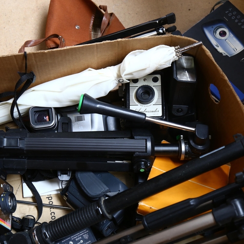 311 - A quantity of Vintage cameras and other accessories, to include 3 tripods, a Canon C-8 grip cine cam... 