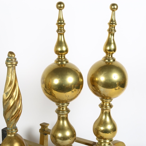 329 - A pair of ornate brass andirons, height 47cm, and a pair of brass and steel andirons