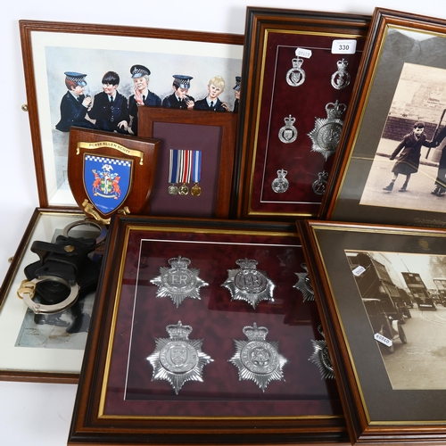 330 - A collection of police memorabilia, including framed badges, 