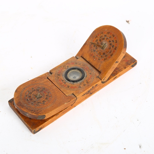 340 - A small Chinese treen combination compass and sundial, length 15cm