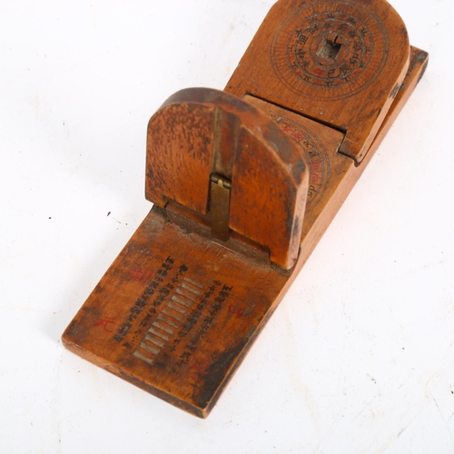 340 - A small Chinese treen combination compass and sundial, length 15cm