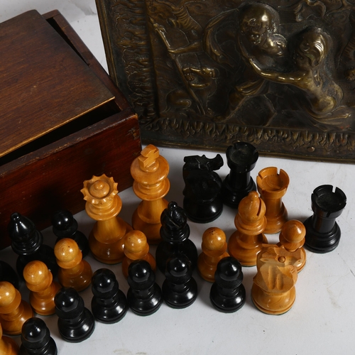 351 - A turned wood chess set in box, King height 8.5cm, and an embossed brass box, with design of figures... 