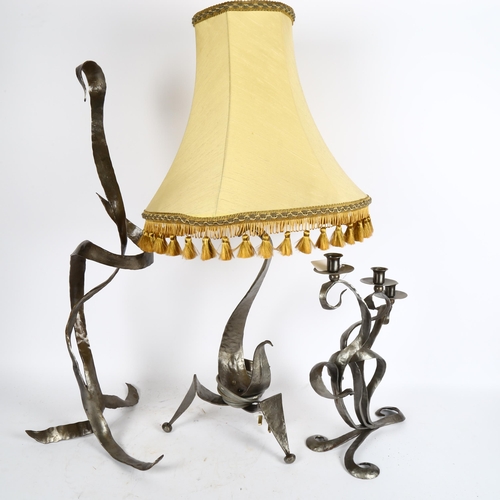 391 - A sculptural metal table lamp, on tripod base, with shade, height 70cm, a wrought-metal 3-branch can... 