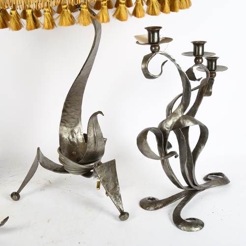 391 - A sculptural metal table lamp, on tripod base, with shade, height 70cm, a wrought-metal 3-branch can... 