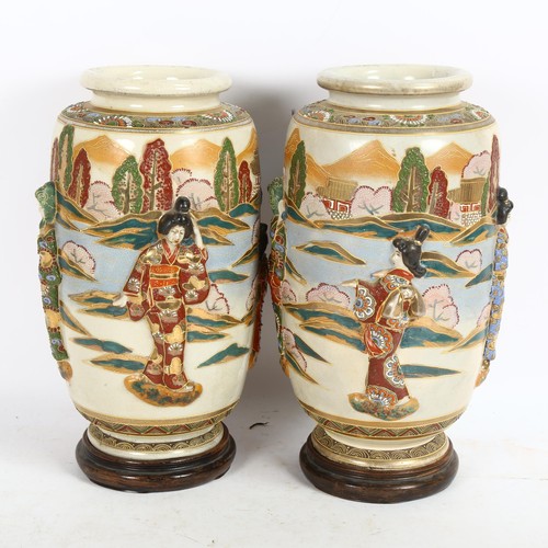 232 - A pair of large Japanese Satsuma cylinder vases, with applied Geisha and gilded decoration, on turne... 